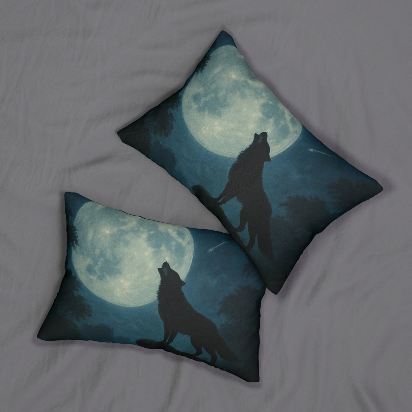 Two pillows with wolf designs against a moonlit sky on a bed.