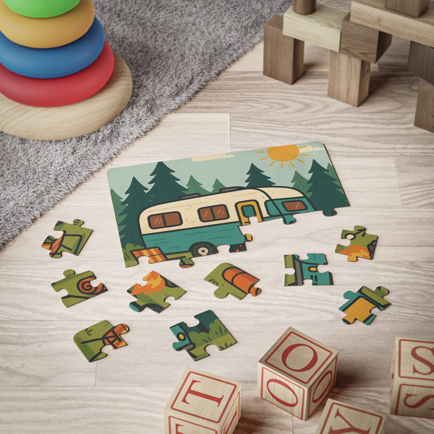 Children's puzzle with camper design and scattered letters on a wooden floor.